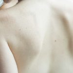 bare shoulders and back of a Caucasian woman